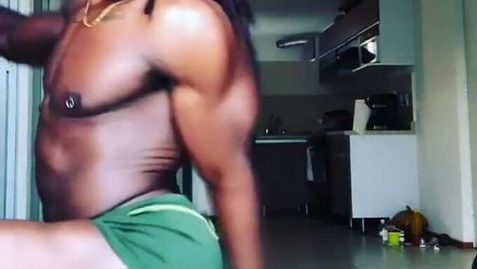 African-American man performs twerking moves with voluptuous breasts